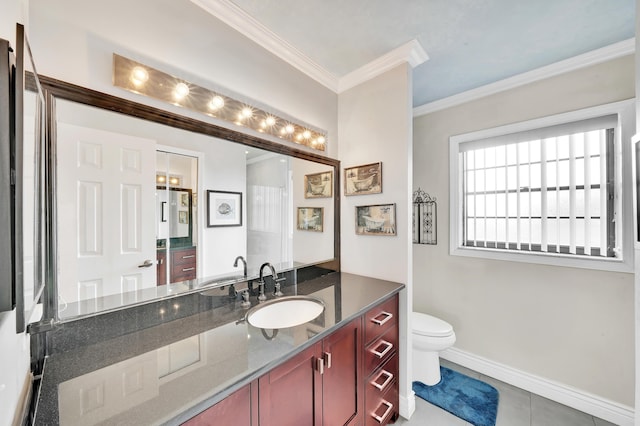 bathroom with crown molding, vanity, toilet, and tile patterned flooring