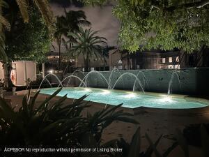 view of pool featuring pool water feature