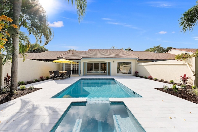 view of swimming pool with a patio