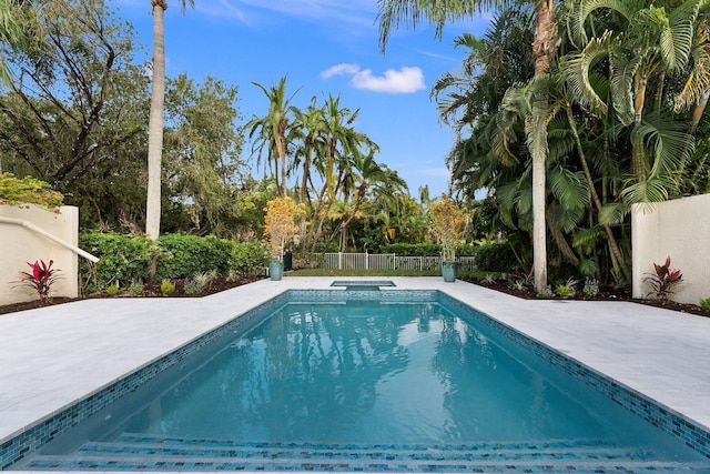 view of pool featuring a patio