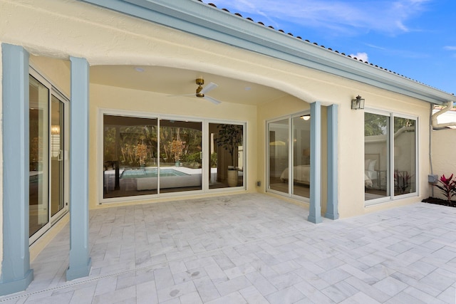 view of patio / terrace featuring ceiling fan