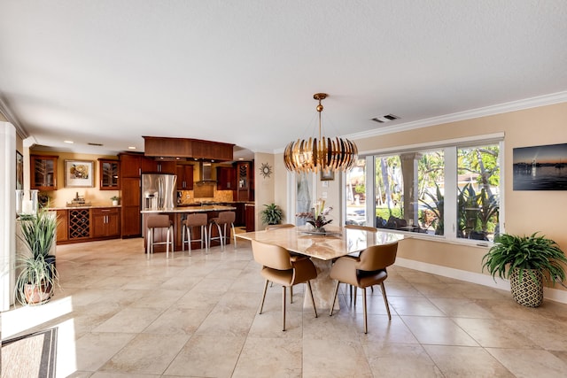 dining area with an inviting chandelier and crown molding