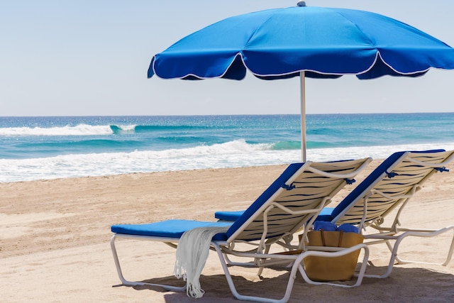 property view of water featuring a beach view