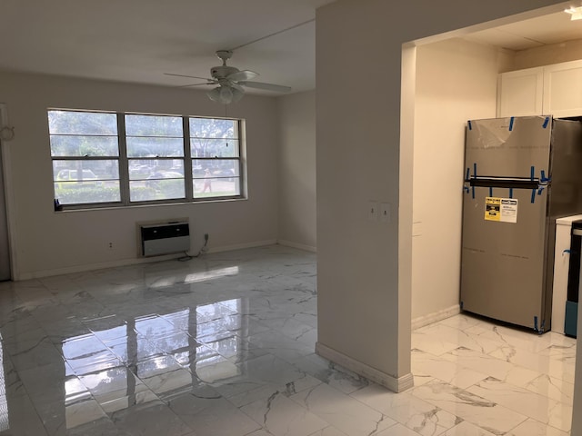 unfurnished living room featuring ceiling fan, a healthy amount of sunlight, and heating unit