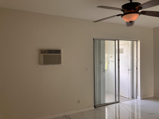 empty room featuring a wall mounted air conditioner and ceiling fan