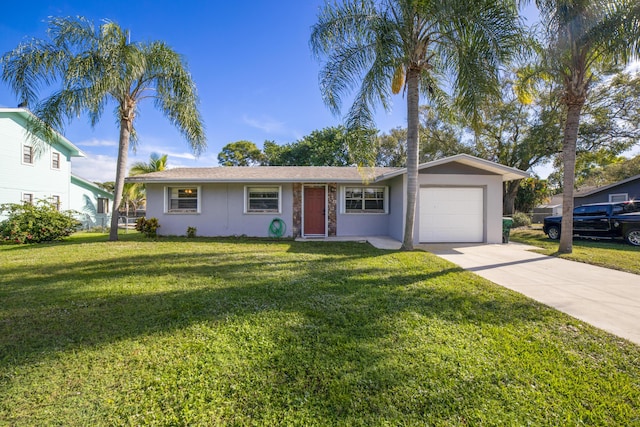 ranch-style house featuring a garage and a front yard