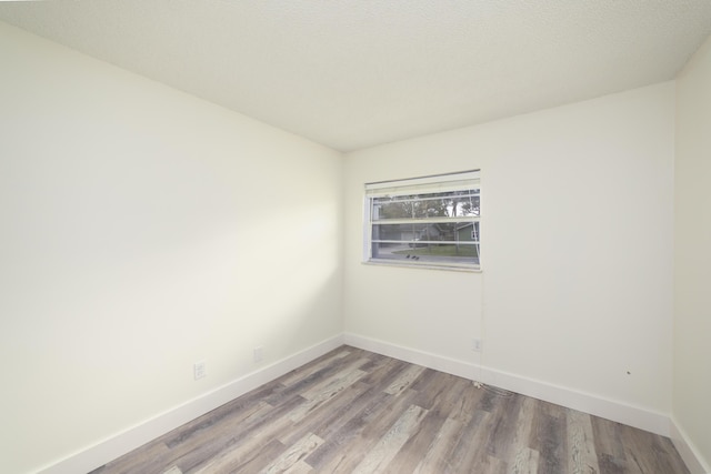 spare room featuring hardwood / wood-style flooring