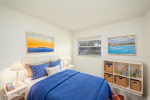 bedroom featuring wood-type flooring