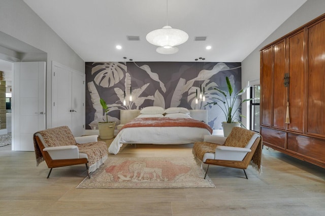 bedroom featuring light wood-style flooring, visible vents, and recessed lighting