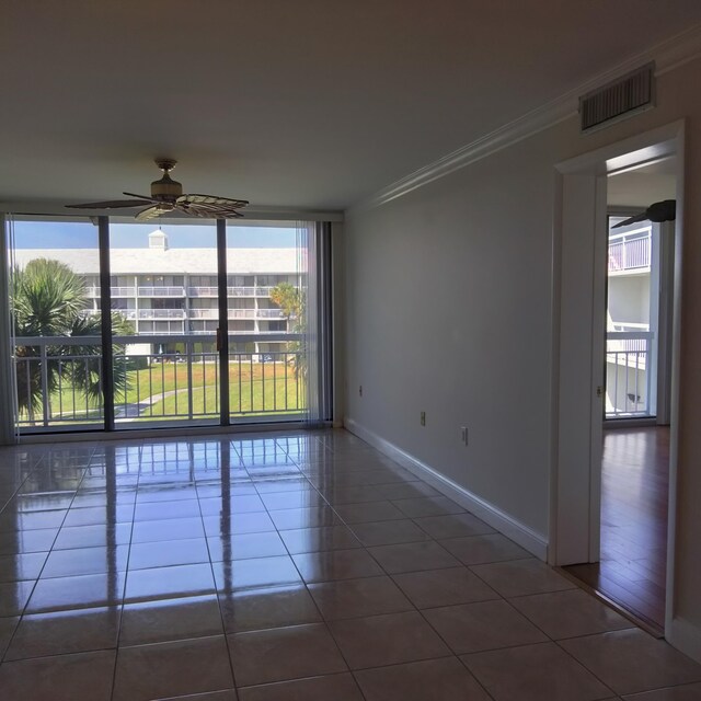 2441 Village Blvd Unit 306, West Palm Beach, FL 33409 - full bath featuring visible vents, tile patterned flooring, double vanity, a shower stall, and a sink