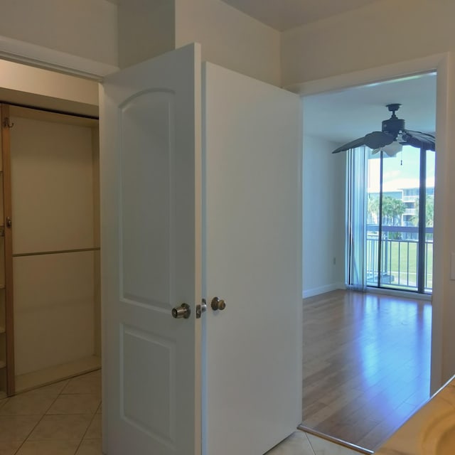 hallway with light tile patterned flooring