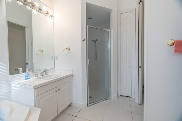 bathroom featuring tile patterned floors, vanity, and an enclosed shower