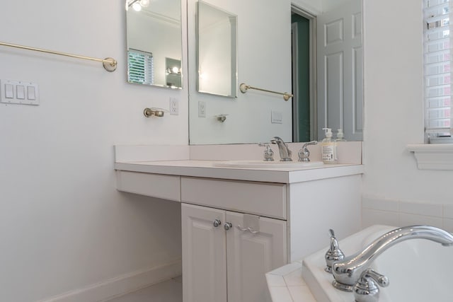 bathroom featuring a bathing tub and vanity