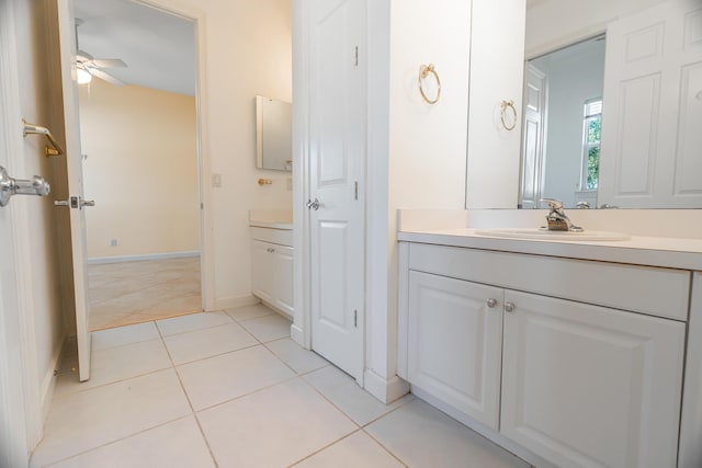 bathroom featuring tile patterned flooring, vanity, and ceiling fan