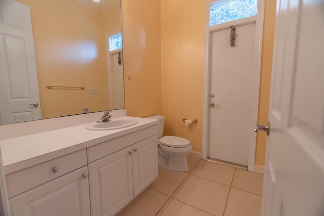 bathroom featuring tile patterned flooring, vanity, and toilet