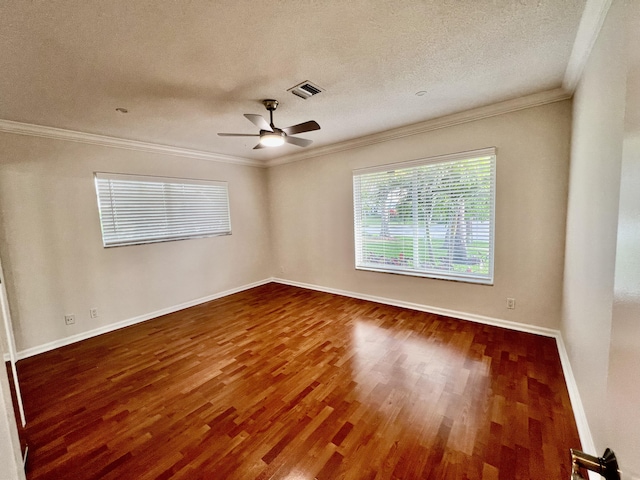 850 Holly Ln, Boca Raton, FL 33486 - spare room featuring crown molding, a textured ceiling, visible vents, wood finished floors, and baseboards