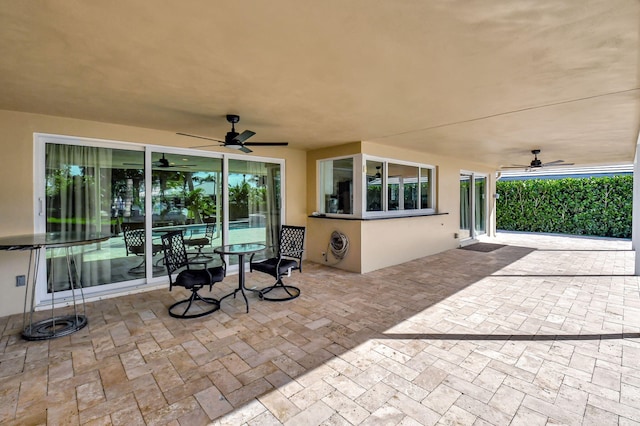 view of patio / terrace featuring ceiling fan