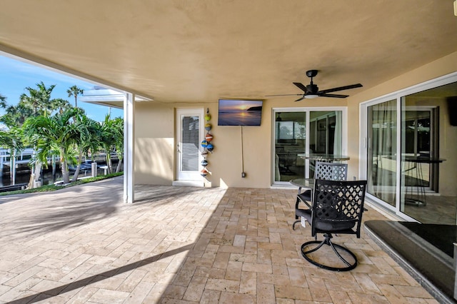 view of patio featuring ceiling fan