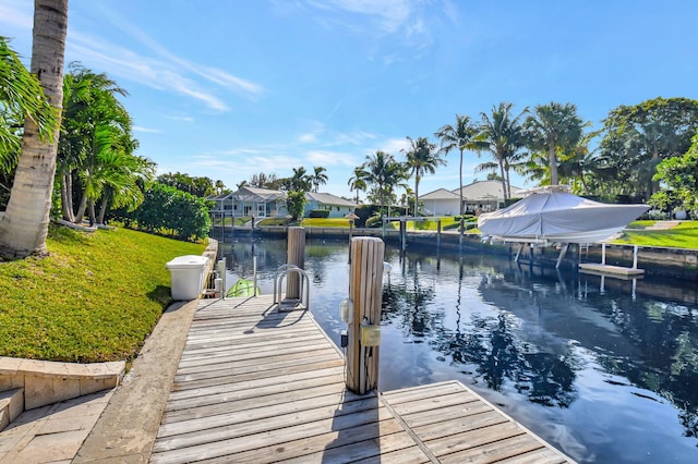 850 Holly Ln, Boca Raton, FL 33486 - view of dock with a water view, a residential view, and a yard
