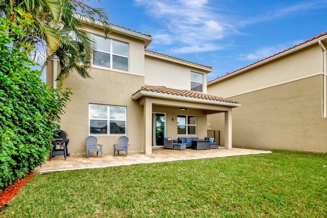 rear view of property with an outdoor hangout area, a yard, and a patio area