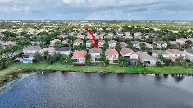 birds eye view of property featuring a water view