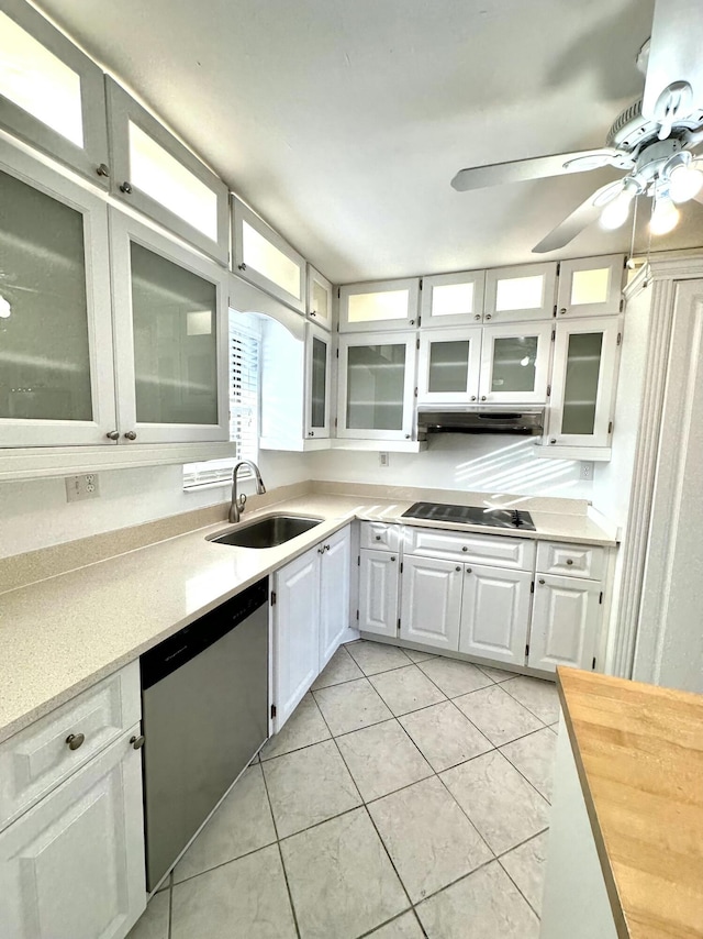 kitchen with white cabinetry, sink, cooktop, stainless steel dishwasher, and light tile patterned floors