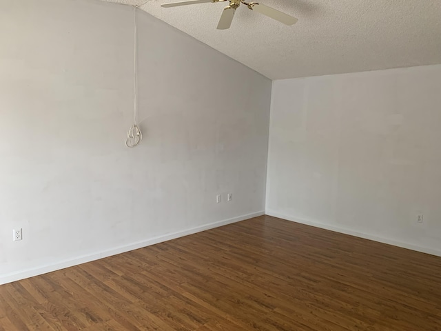 unfurnished room featuring a textured ceiling, ceiling fan, and dark wood-type flooring