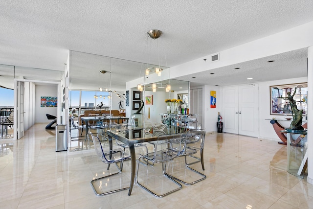 dining area featuring a textured ceiling