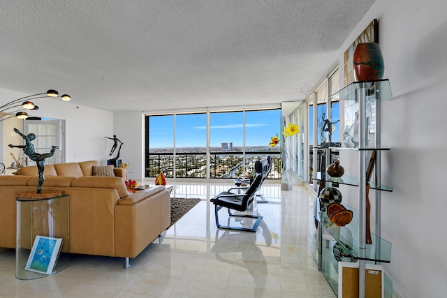 living room with floor to ceiling windows and a textured ceiling