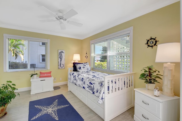 bedroom featuring ceiling fan and light hardwood / wood-style flooring