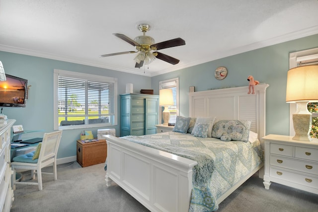 carpeted bedroom with ceiling fan and ornamental molding