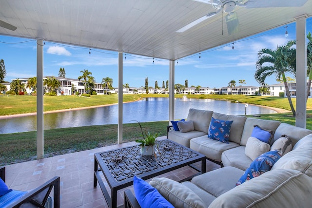 view of patio featuring an outdoor living space, a water view, and ceiling fan