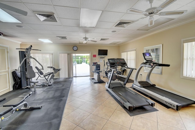 exercise room with a paneled ceiling and crown molding