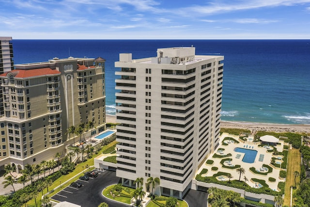 bird's eye view featuring a water view and a view of the beach