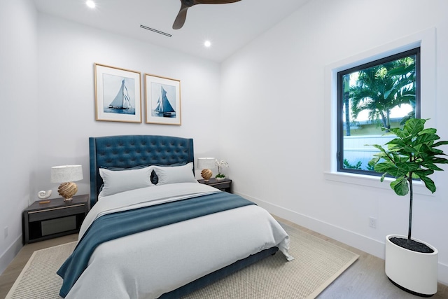 bedroom featuring ceiling fan and light hardwood / wood-style floors