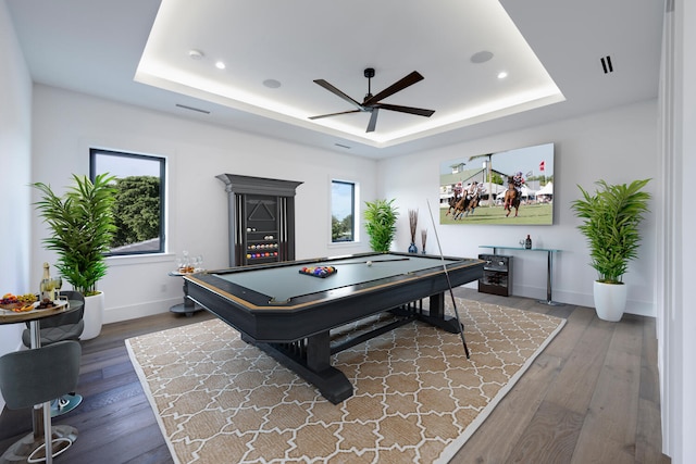 game room featuring hardwood / wood-style flooring, a raised ceiling, and pool table