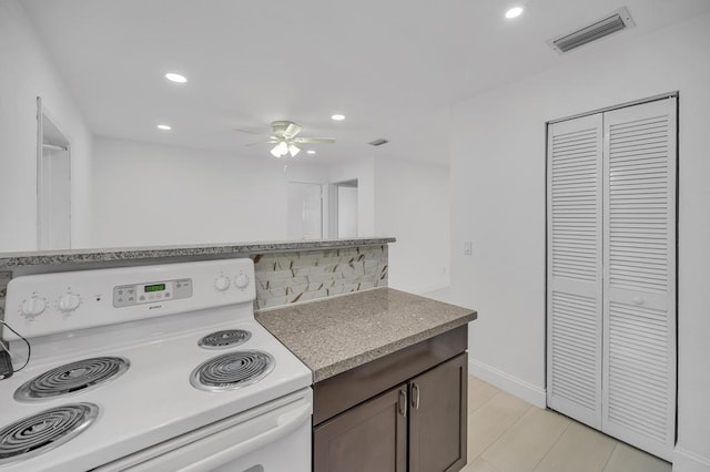 kitchen featuring white range with electric cooktop and ceiling fan