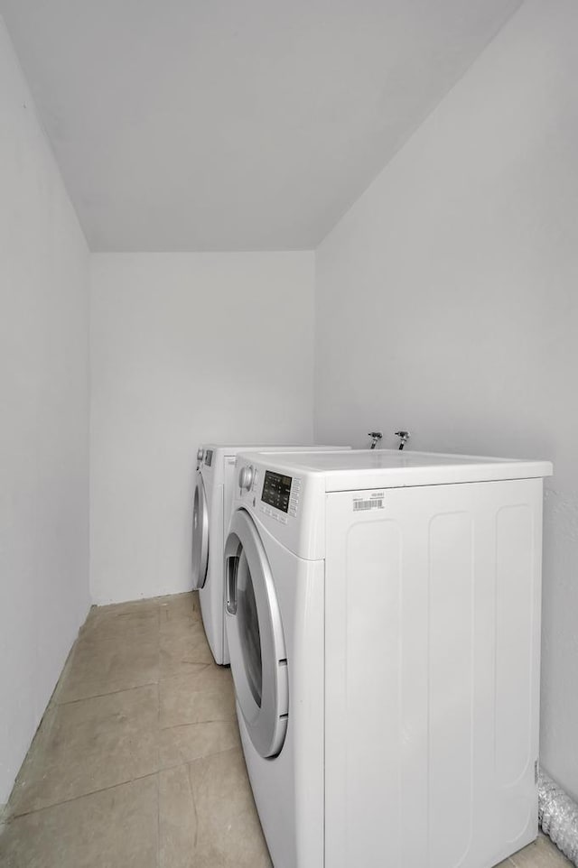 laundry area with washing machine and clothes dryer