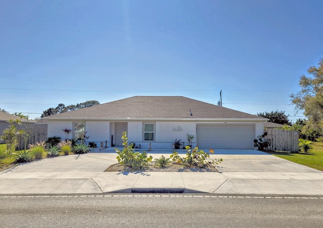 ranch-style home featuring a garage