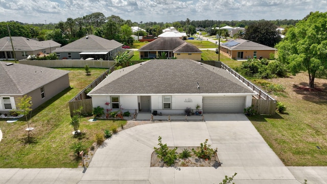 birds eye view of property with a residential view