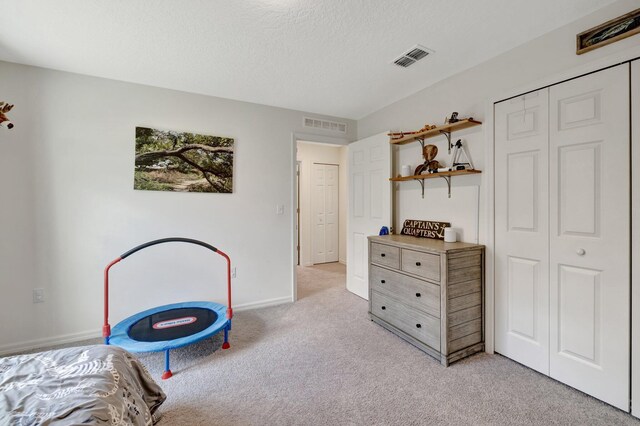 office space with carpet floors and a textured ceiling