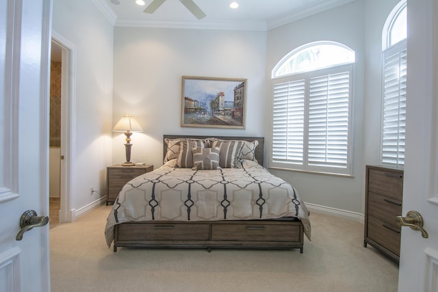 bedroom with light colored carpet, ceiling fan, and crown molding