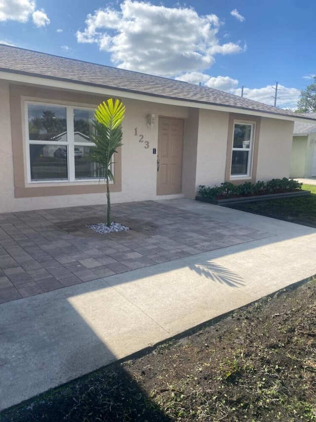 doorway to property featuring a patio