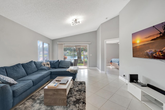 tiled living room featuring a textured ceiling and lofted ceiling