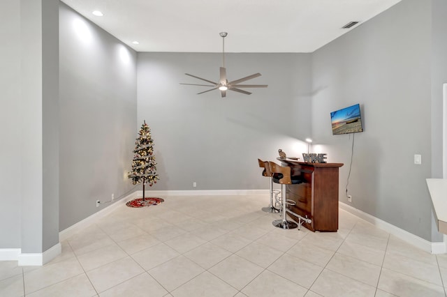 office with ceiling fan and light tile patterned floors