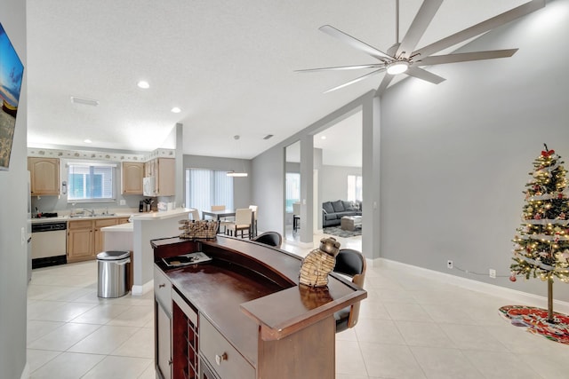 kitchen featuring white appliances, a textured ceiling, ceiling fan, light brown cabinets, and light tile patterned floors