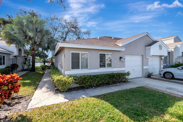 view of front of house featuring a front yard and a garage