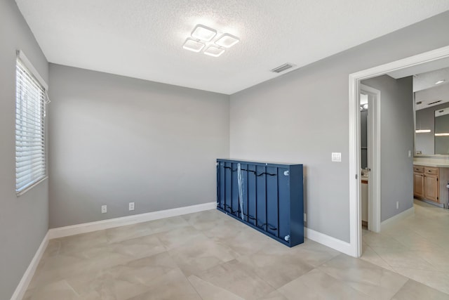 empty room with a textured ceiling