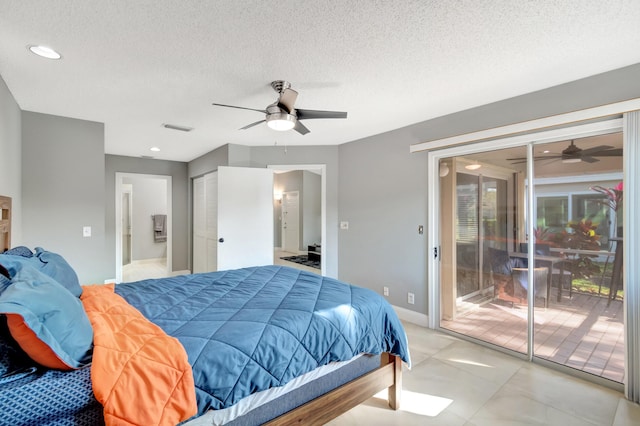 bedroom featuring access to outside, ceiling fan, and a textured ceiling