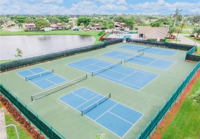 view of sport court featuring a water view and basketball hoop